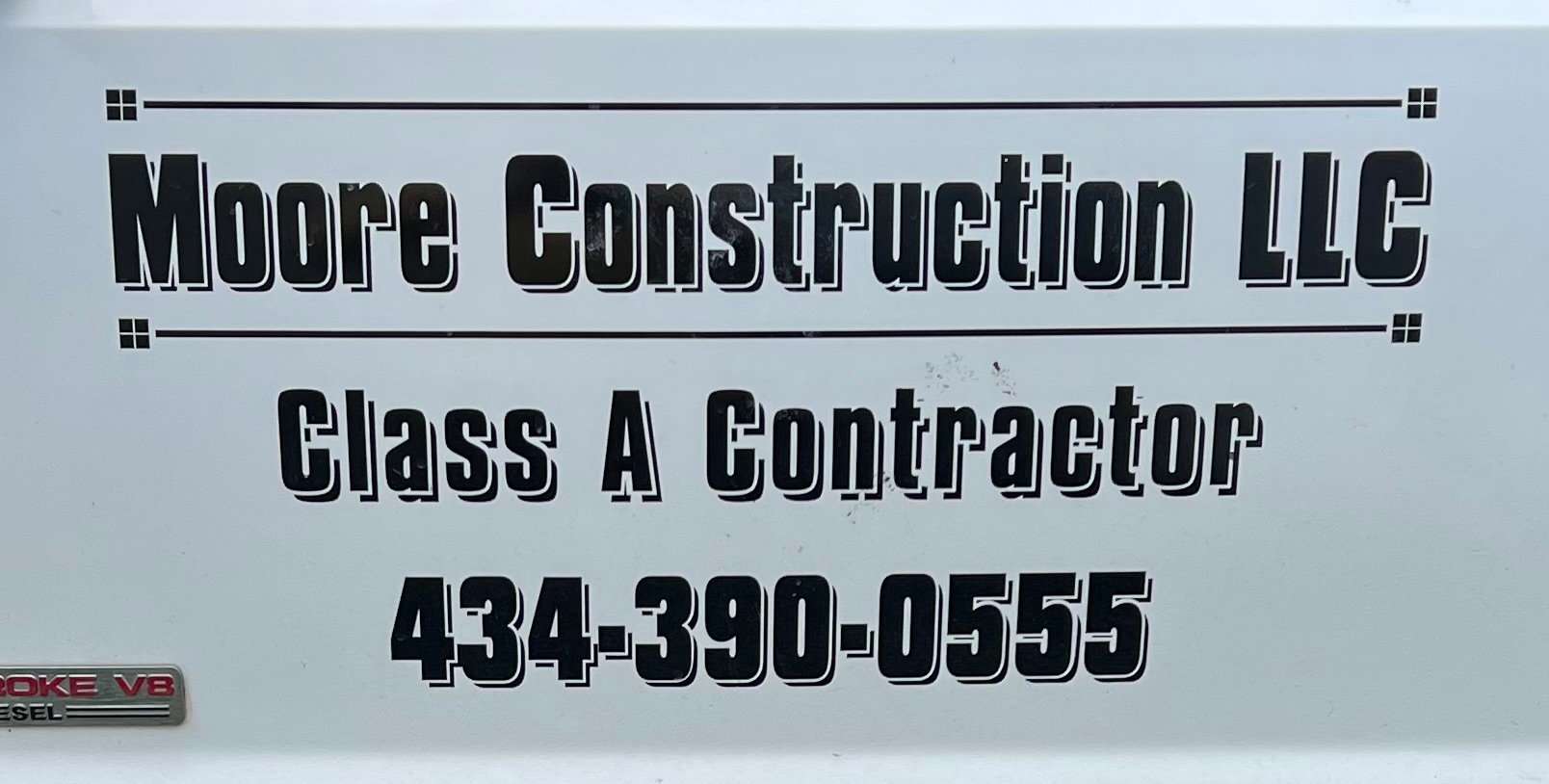 Moore Construction LLC logo
